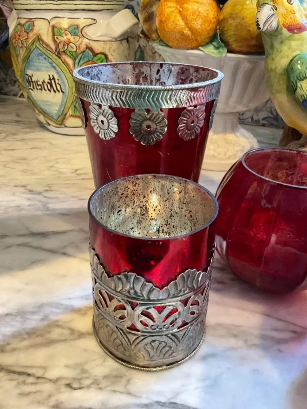 Set of lovely gathered red glass candlesticks, votive holders and vases